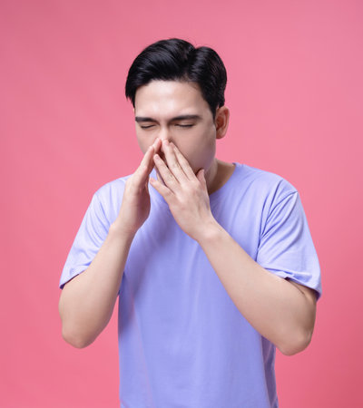 Young Asian man sick, illness on backgroundの写真素材