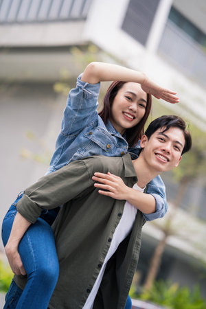Photo of young Asian couple outdoorの写真素材