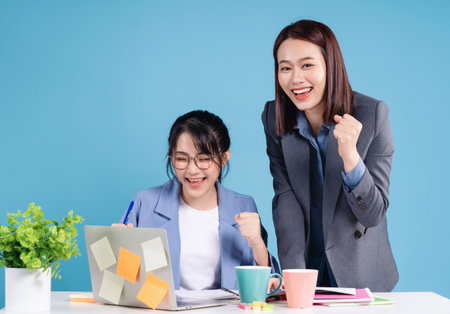 Two Asian businesswoman working backgroundの写真素材