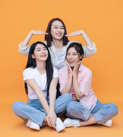 Image of young three Asian girl on backgroundの写真素材