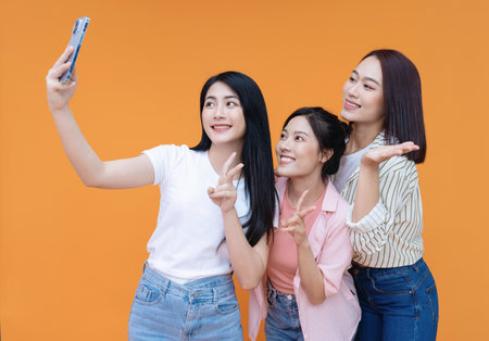 Image of young three Asian girl on backgroundの写真素材
