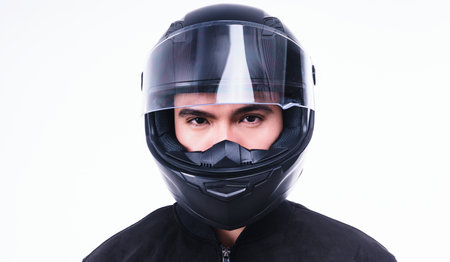 Image of young Asian man with helmet on backgroundの写真素材