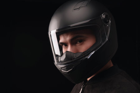 Image of young Asian man with helmet on backgroundの写真素材