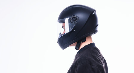 Image of young Asian man with helmet on backgroundの写真素材