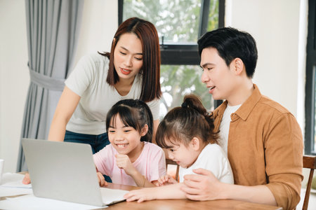 Young Asian family at homeの写真素材