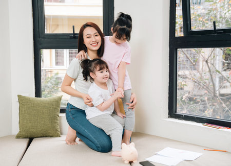 Image of young Asian mother and daughter at homeの写真素材