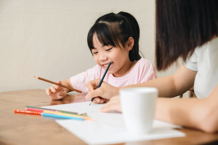 Image of young Asian mother and daughter at homeの写真素材