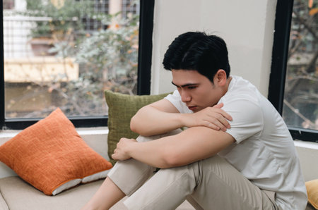 Image of young Asian man at homeの写真素材