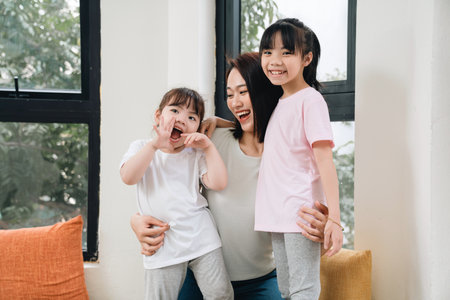 Image of young Asian mother and daughter at homeの写真素材