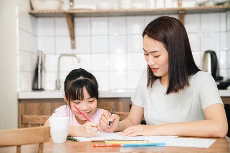 Image of young Asian mother and daughter at homeの写真素材