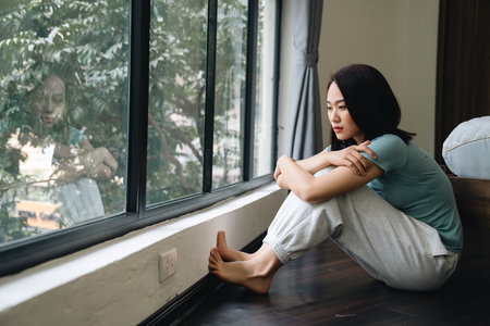 Young Asian woman at homeの写真素材
