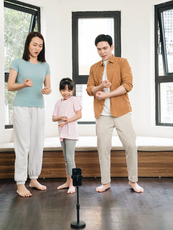 Young Asian family at homeの写真素材