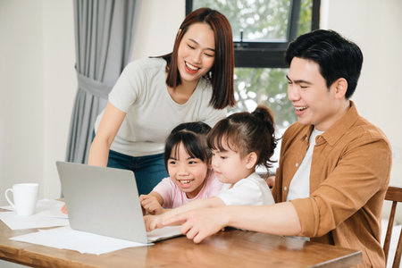 Young Asian family at homeの写真素材