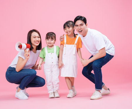 Young Asian family on backgroundの写真素材