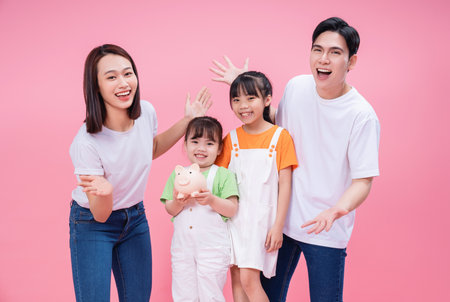 Young Asian family on backgroundの写真素材