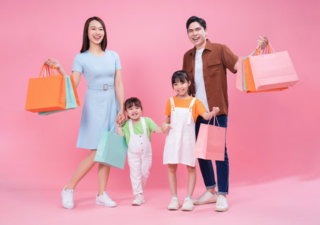 Young Asian family on backgroundの写真素材