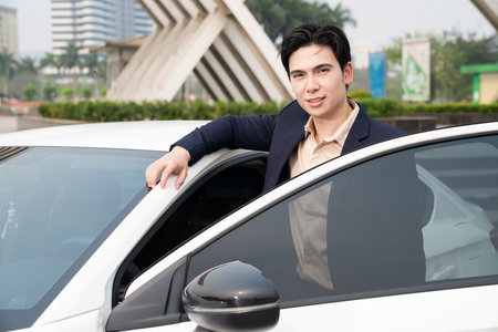 Young Asian business man with carの写真素材
