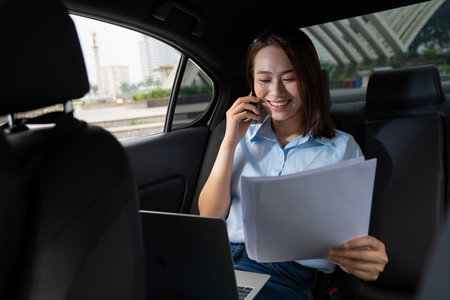 Young Asian woman with carの写真素材