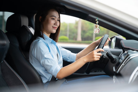 Young Asian woman with carの写真素材