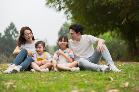 Young Asian family in the parkの写真素材