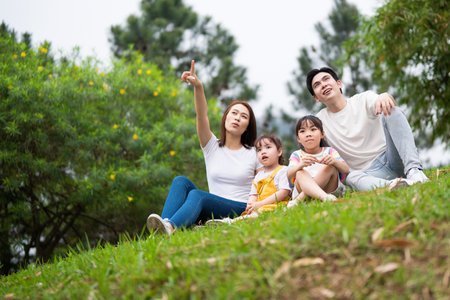 Young Asian family in the parkの写真素材