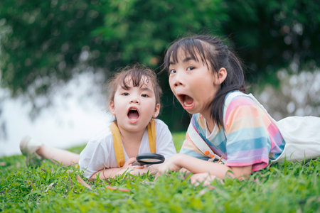 Photo of young Asian baby girl playing at parkの写真素材