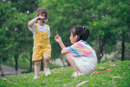 Photo of young Asian baby girl playing at parkの写真素材