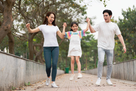 Young Asian family in the parkの写真素材