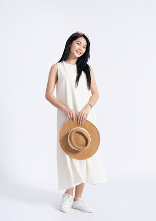 Photo of young Asian girl wearing dress on backgroundの写真素材