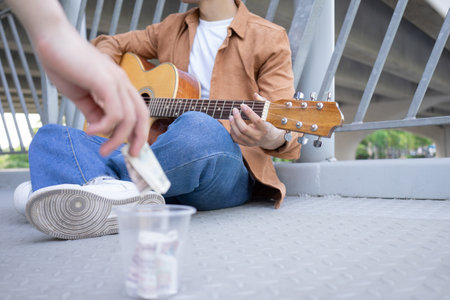 Portrait of young Asian man outsideの写真素材