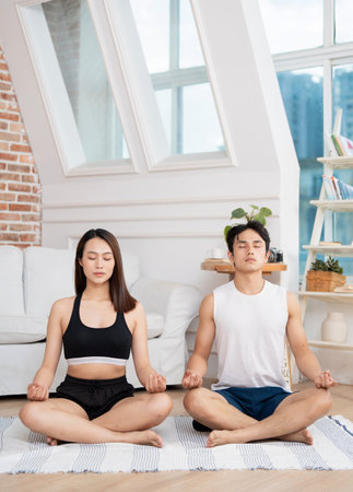 Photo of young Asian couple at homeの写真素材