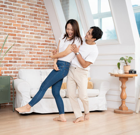 Photo of young Asian couple at homeの写真素材