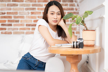 Photo of young Asian woman at homeの写真素材
