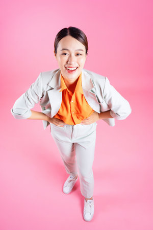 Photo of young Asian businesswoman on backgroundの写真素材