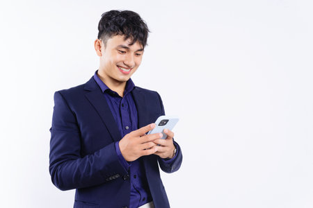 Photo of young Asian businessman on white backgroundの写真素材