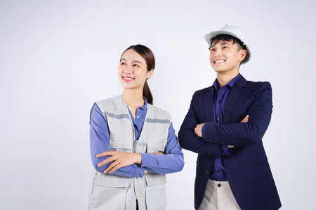 Photo of two young Asian business people on white backgroundの写真素材