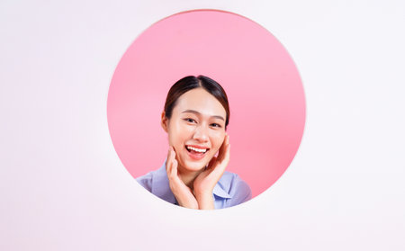 Photo of young Asian woman on backgroundの写真素材