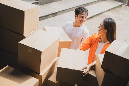 Photo of young Asian couple working togetherの写真素材
