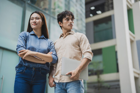 Photo of young Asian business people working outdoorの写真素材