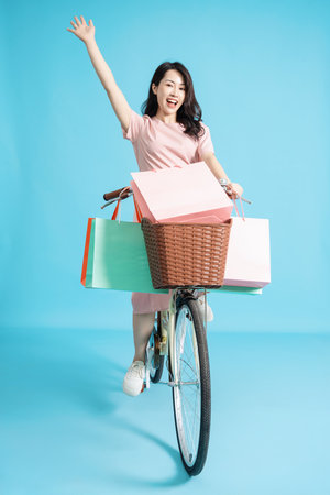 Photo of young Asian woman on backgroundの写真素材