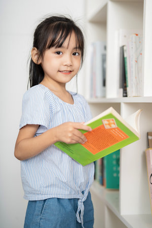 Photo of young Asian baby girl studying at homeの写真素材