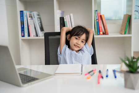 Photo of young Asian baby girl studying at homeの写真素材