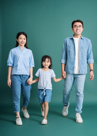 Photo of young Asian family on backgroundの写真素材