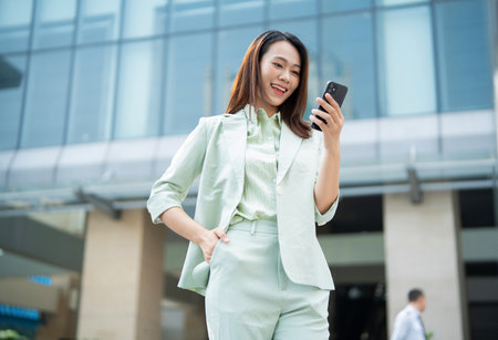 Portrait of young Asian businesswoman outside the officeの写真素材