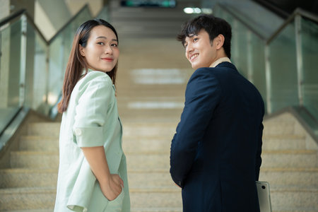 Photo of two young Asian businesspeople