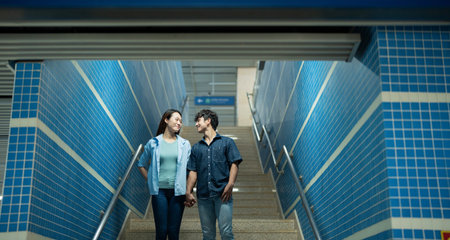 Photo of young Asian couple hang out together