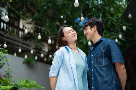 Photo of young Asian couple hang out togetherの写真素材