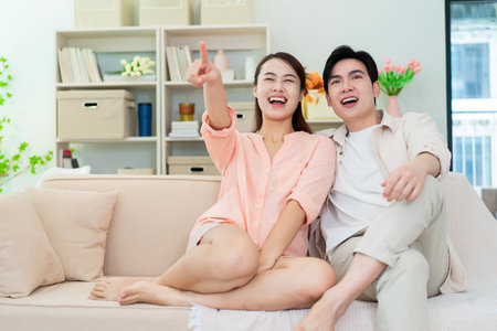 Photo of young Asian couple at homeの写真素材