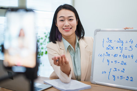A math tutor is engaging with students through a virtual session, using a whiteboard to illustrate...