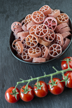 Red ruote (pasta) and tomatoesの写真素材